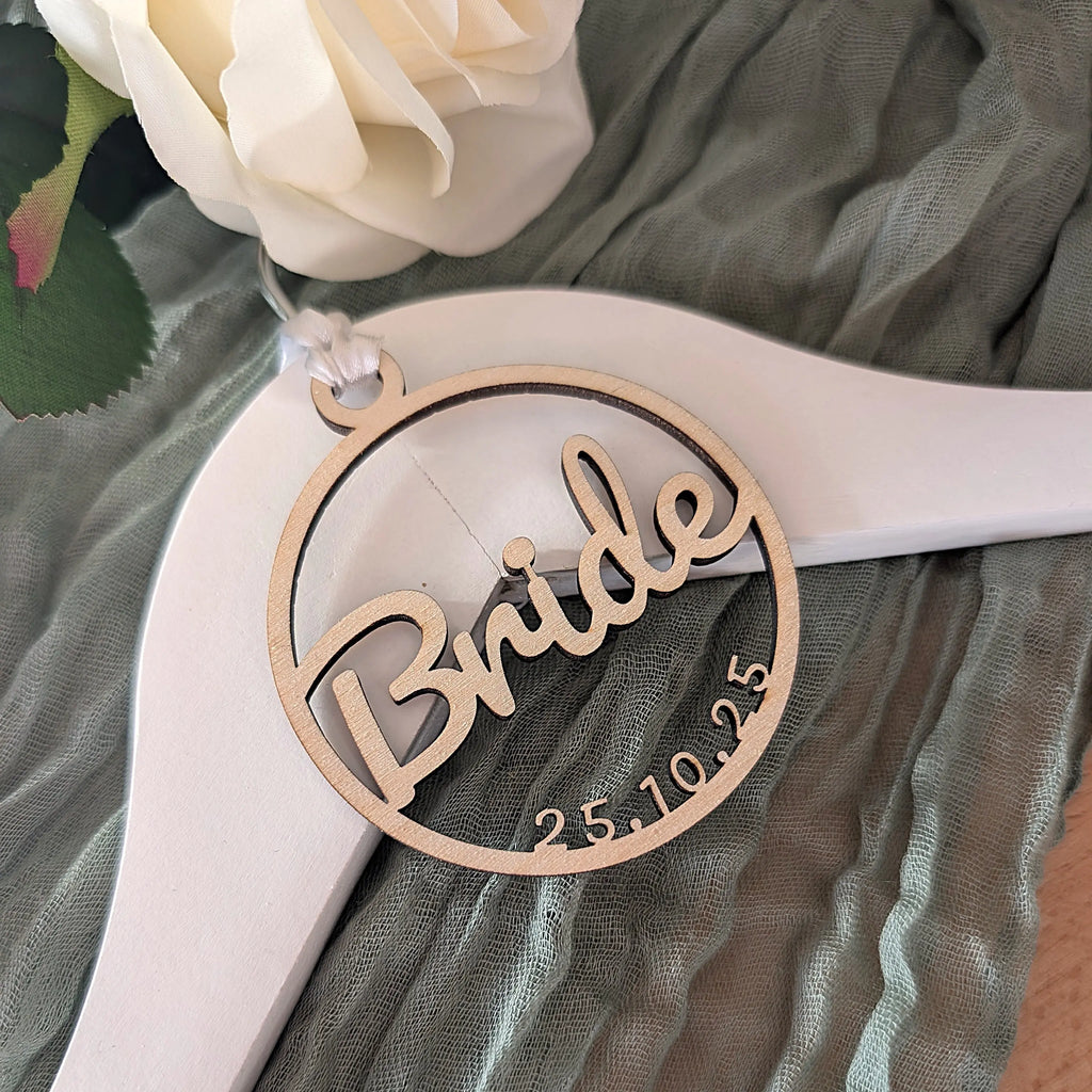 Wooden 'Bride' ornament with date on a sheer fabric background